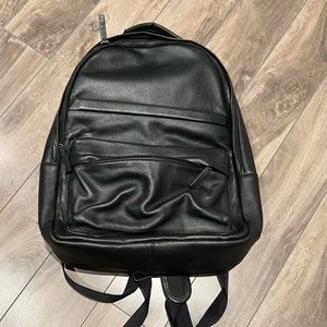 Genuine Leather laptop black backpack with strap to hook on a carry-on handle